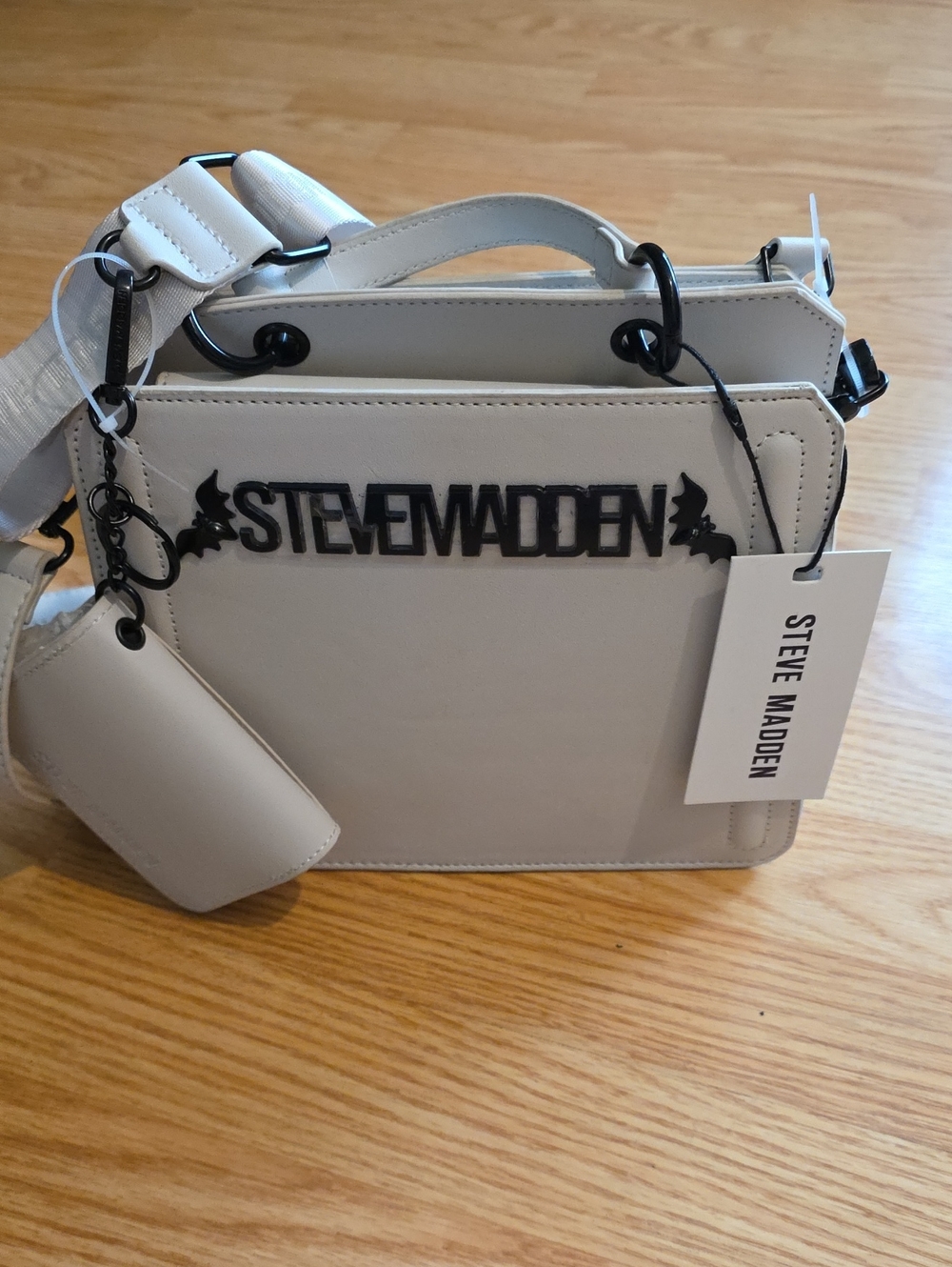 Steve Madden White Crossbody with Black Bats Logo
